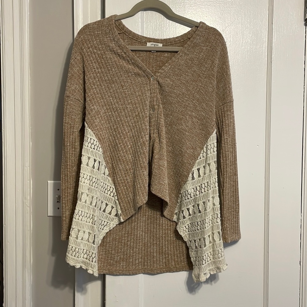 High low sweater with button up front and lace details on side. Size S